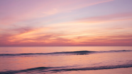 Obraz premium Peaceful sunset over calm ocean waves.