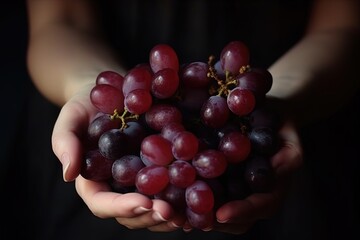 Grapes in the hands of a woman
