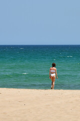 Girl on Jebel Sifah Public Beach. Oman