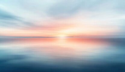 Blurry sunset over calm water, soft colors