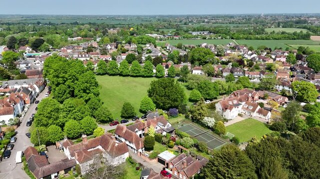 Pull back drone aerial reverse reveal Writtle Village Essex UK