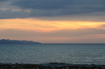 Dramatic Cyprus sunset over sea and mountains
