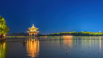 Enchanting Nightscape of a Tranquil Waterfront Under Starry Skies
