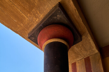 Ancient red and black column in Knossos ruins