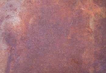 Rusty metal sheet with rich, textured corrosion patterns. Industrial background