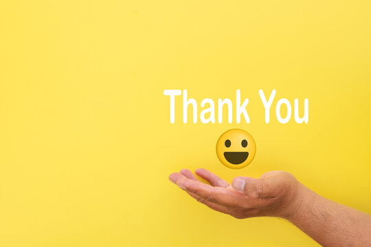 Grateful message "Thank You" with smiley face on a yellow background, representing appreciation, thanks, happiness, and gratitude. Great for personal notes, positive feedback, or thank you campaigns.