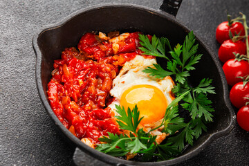 Fried egg tomatoes shakshuka vegetable dish appetizer fresh delicious gourmet food background on the table rustic food top view copy space vegetarian  food