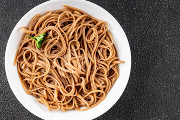 Buckwheat noodles soba in a bowl fresh dish Asian cuisine on the table rustic food top view copy space
