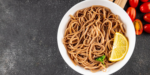Buckwheat noodles soba in a bowl fresh dish Asian cuisine on the table rustic food top view copy space