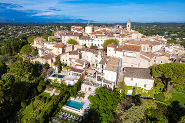 Fototapeta premium Aerial view above the Village of Mougins, France in the French Riviera at sunset
