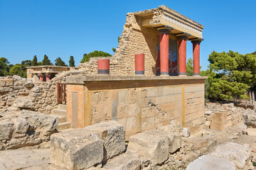 Ancient ruins of Knossos Palace with red columns