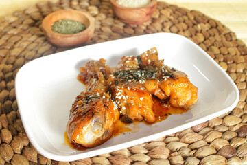 Stir-fried chicken dish with soy sauce and sprinkled with nori. Delicious restaurant dish grilled chicken