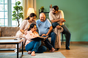 Flipping through old album, Indian family laughs together while reliving cherished moments
