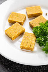 Broth cube vegetable, meat broth concentrated broth chicken, pork, beef meat natural food fresh dish on the table rustic food top view copy space