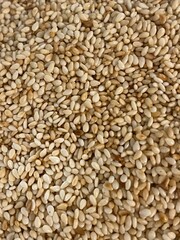 Roasted sesame seeds background 