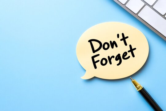 Don't forget reminder on speech bubble with pen and keyboard