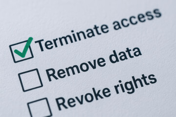 Terminate access concept with green check mark on paper form for security and control in digital data management