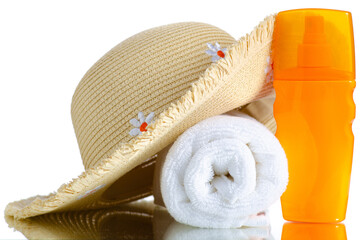 Summer straw hat, sunscreen, towel on white background isolation, vacation concept