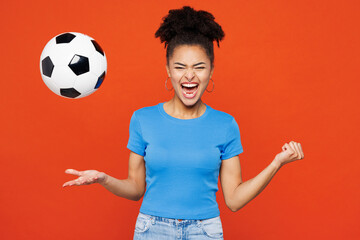 Young overjoyed excited woman fan wears basic blue t-shirt cheer up support football sport team...