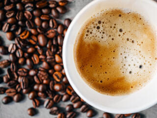 Coffee crema espresso in paper Coffee cup and bean, close-up, Top view of Espresso in  Takeaway paper coffee cup