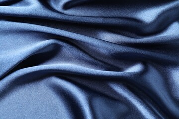 Fototapeta premium Blue crumpled silk fabric as background, top view