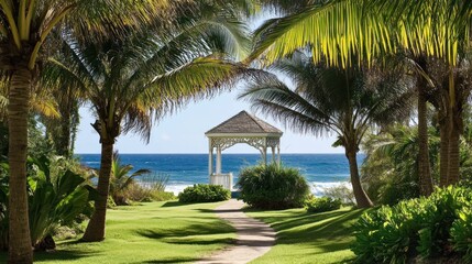 Fototapeta premium Tropical gazebo overlooking the ocean. Lush vegetation frames a paved walkway leading to a charming white gazebo. Ocean waves gently lap the shore beyond