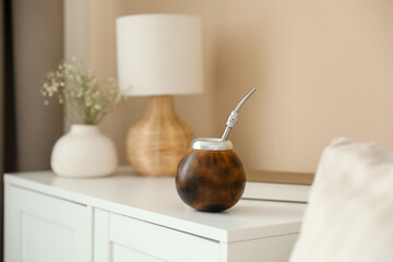 Traditional yerba mate tea on nightstand indoors