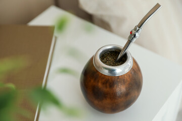 Traditional yerba mate tea on bedside table indoors, closeup