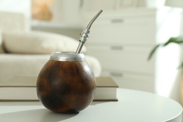 Traditional yerba mate tea on white table indoors