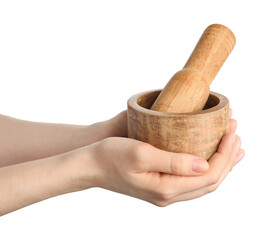 Woman with mortar and pestle on light background, closeup