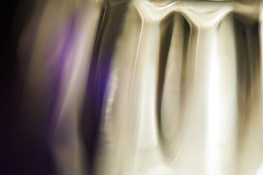Abstract Flowing Purple and Light Gradient Background
