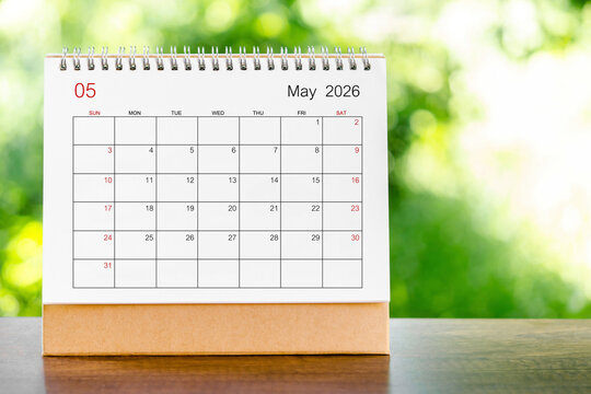 May 2026 Calendar desk for organizer to plan and reminder on wooden table.