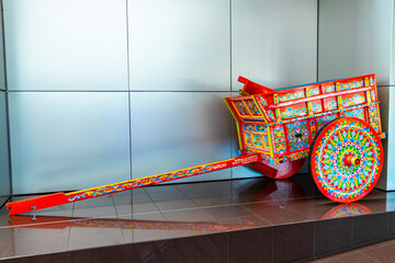 Naklejka premium Colorful old Costa rican trailer wheelbarrow in Alajuela Costa Rica.