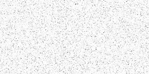 Terrazzo background with scattered gray and black dots. Rock spatter stone marble backdrop. White wall texture with noise overlay pattern. Vintage quartz terrazzo flooring.