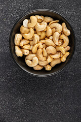 Cashew nuts natural superfood natural food vegetables dish organic product fresh tasty gourmet food background on the table rustic food top view copy space keto and paleo diet vegetarian vegan food