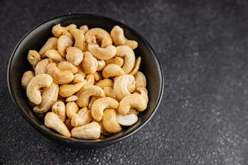 Cashew nuts natural superfood natural food vegetables dish organic product fresh tasty gourmet food background on the table rustic food top view copy space keto and paleo diet vegetarian vegan food