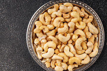 Cashew nuts natural superfood natural food vegetables dish organic product fresh tasty gourmet food background on the table rustic food top view copy space keto and paleo diet vegetarian vegan food