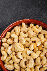 Cashew nuts natural superfood natural food vegetables dish organic product fresh tasty gourmet food background on the table rustic food top view copy space keto and paleo diet vegetarian vegan food