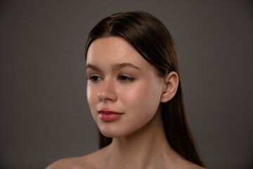Fototapeta premium Portrait of a Young Woman in a Soft Lighting Setup