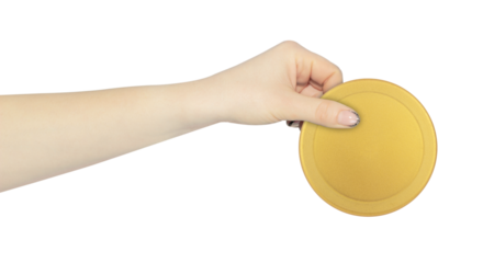 wide cap from a plastic bottle in hand, outstretched hand with cap from a plastic bottle isolated from background	