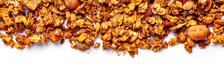 Granola panorama on a white background, with copy space. Organic gourmet muesli, overhead flat lay shot
