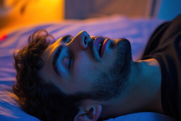 Man sleeping with mouth open illustrates sleep apnea
