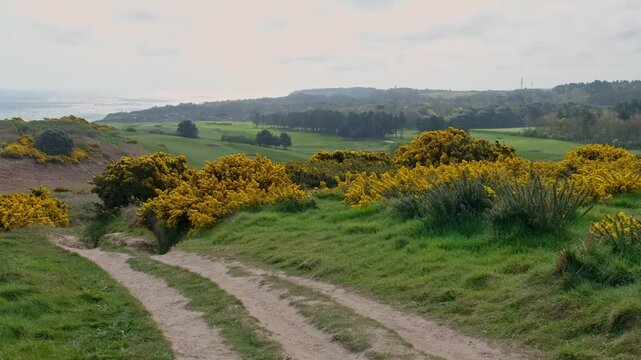 Walking the Paston Way along the clifftops in Cromer, Norfolk Coast. Left to right panning shot