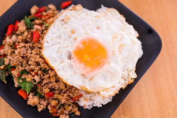 Stir fried minced pork holy basil and egg on rice