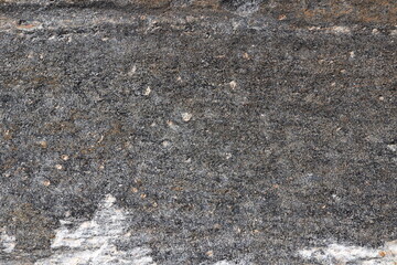 Exploring the intricate texture of weathered stone surfaces under natural light at dawn