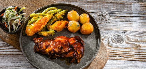 Chicken thighs in tamarind sauce with veggies tempura and potato