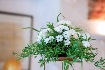 Flowers and Green Branches Adorning Church Interior for First Holy Communion Mass