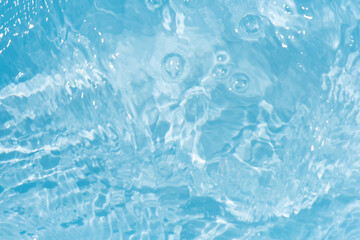 Blue water with ripples on the surface. Defocus blurred transparent blue colored clear calm water...