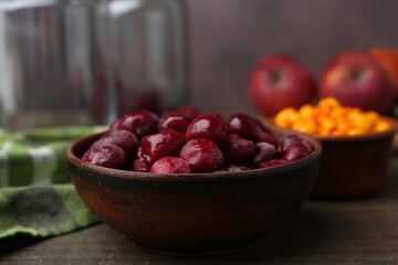 Tasty cherries and other fruits on wooden table, closeup