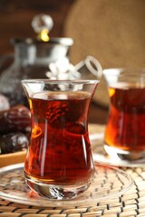 Tasty Turkish tea served on table, closeup